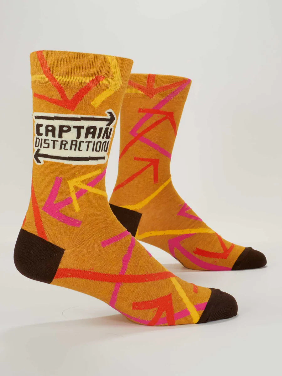 Men's Captain Distraction crew socks, flat side view with orange and pink arrow print