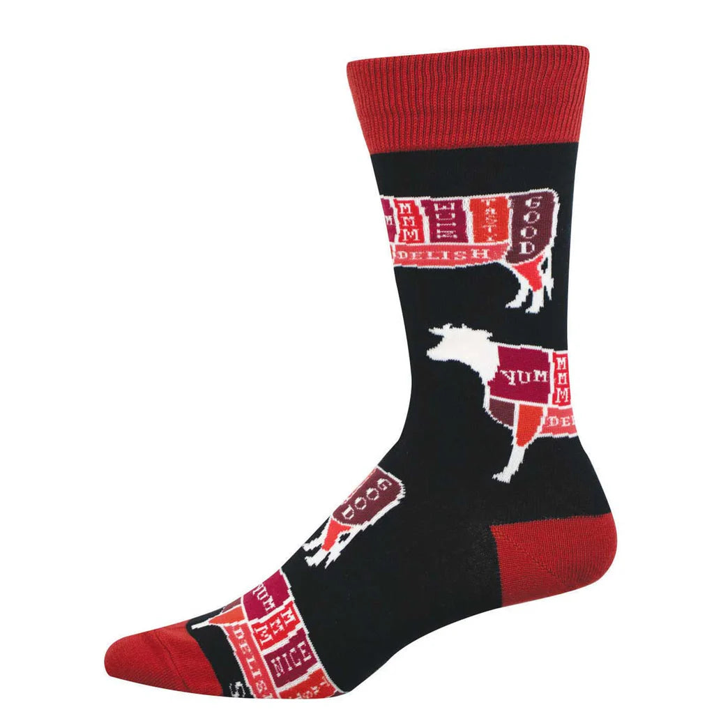 Men's cattle cuts crew socks flat lay in black and red with butcher-chart cow diagrams