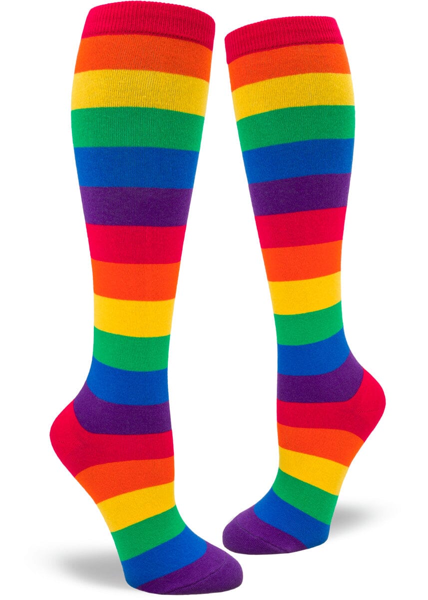 Women's rainbow striped knee high socks in bold ROYGBIV bands, flat lay