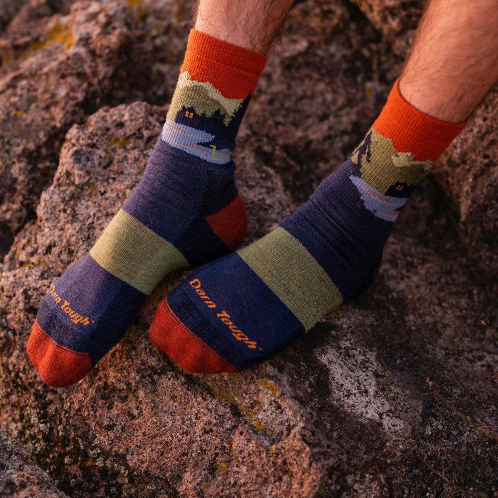 Men's eclipse cabin-scene micro crew socks worn on rock, worn shot