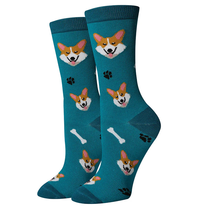 Women's Corgi crew socks flat lay, teal with tan and white corgi faces and paw prints