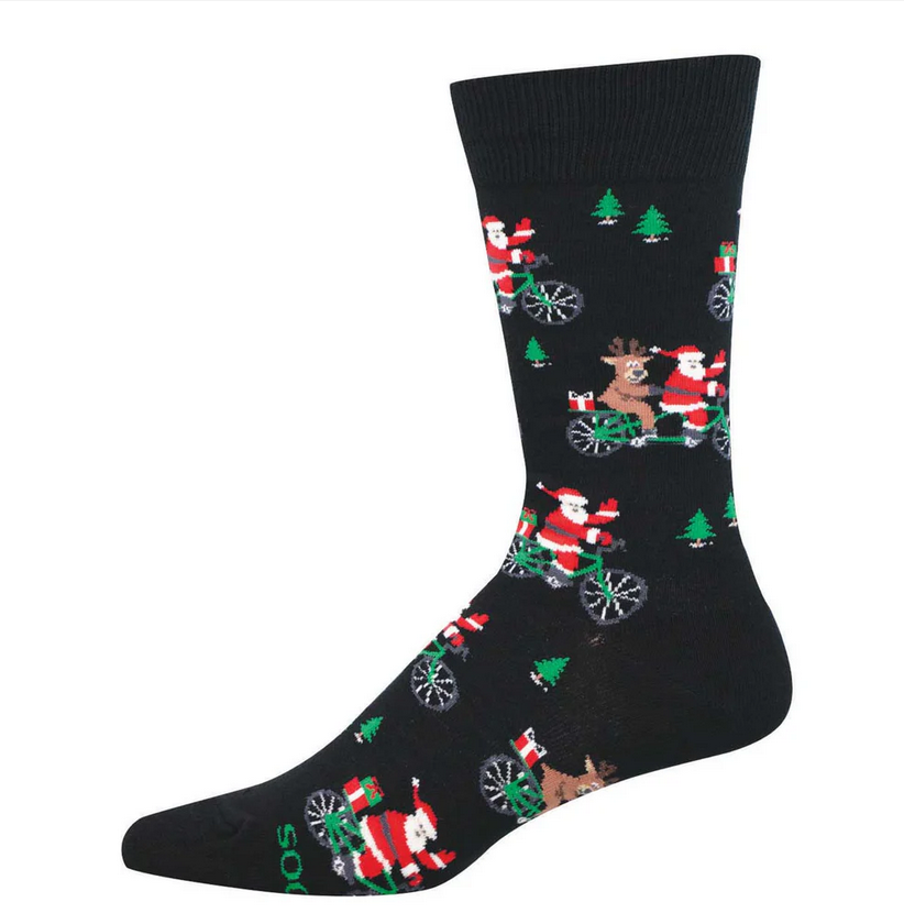 Men's cycling Santa crew socks laid flat, black with Santas riding bicycles and evergreen trees