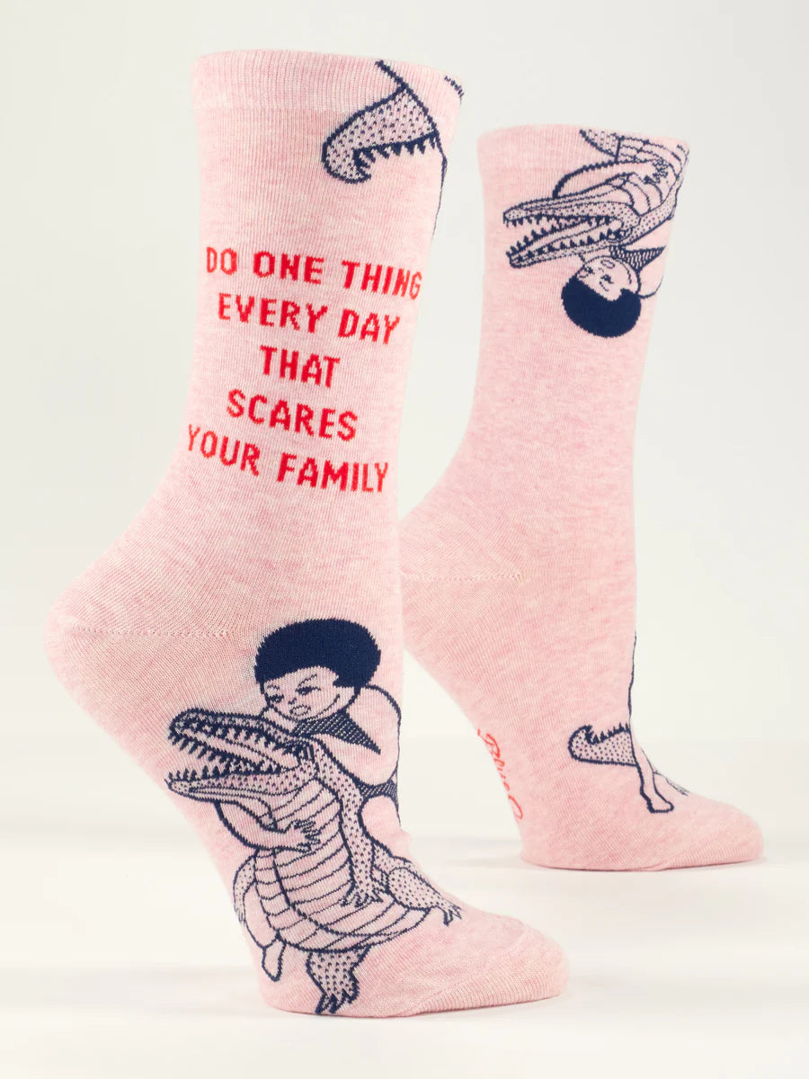 Women's Do One Thing Every Day That Scares Your Family crew socks, flat side view in pink with kid riding alligator