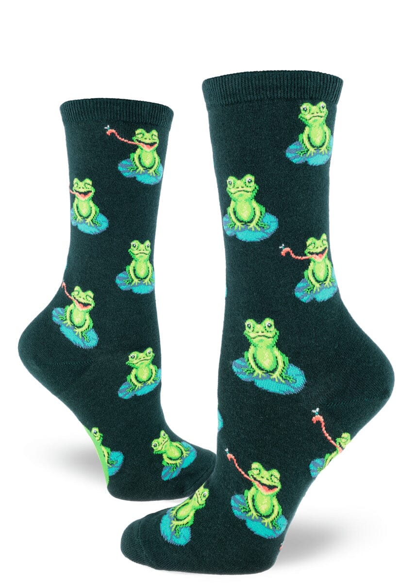 Women's funny frog crew socks shown flat on green with frogs on lily pads