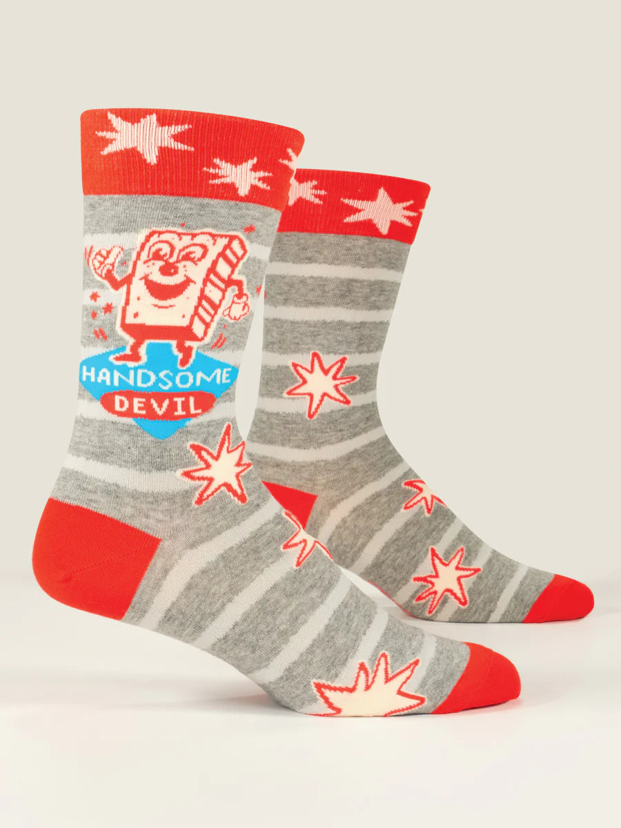 Men's Handsome Devil crew socks, flat side view with cartoon devil and red stars