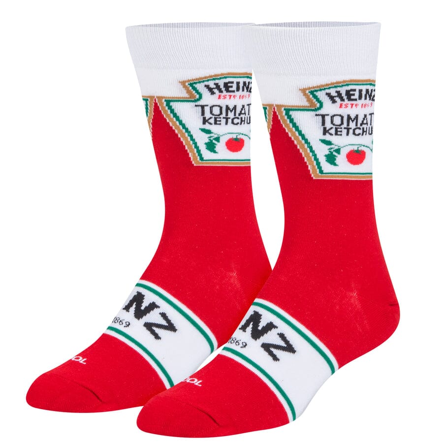 Red men's crew socks designed like a Heinz Tomato Ketchup bottle with white cuff, keystone label, and green-trimmed Heinz band on the foot