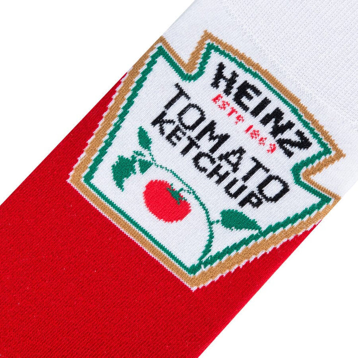 Close-up of the white Heinz Tomato Ketchup keystone label with tomato graphic on red sock fabric