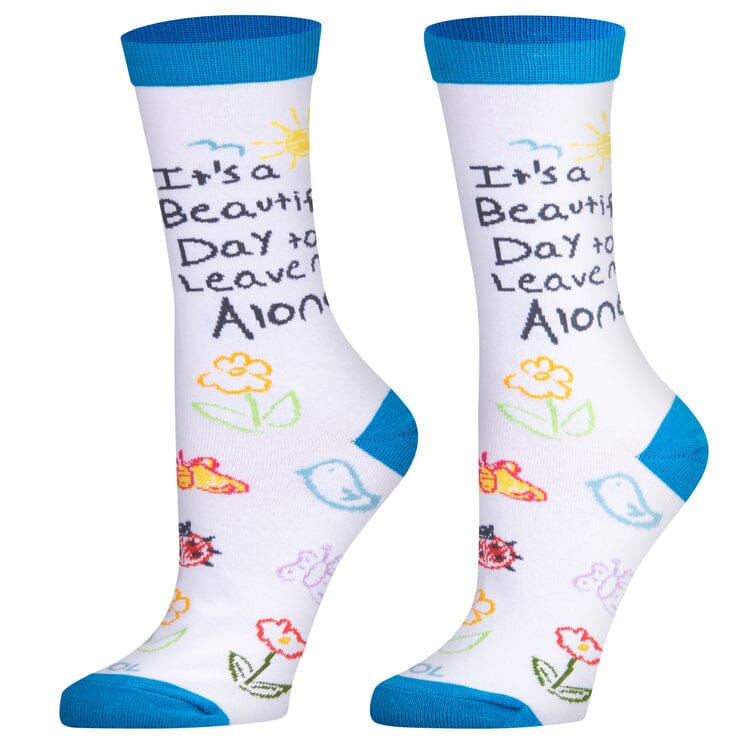Women's slogan crew socks, front view with sun and 'leave me alone' text on white