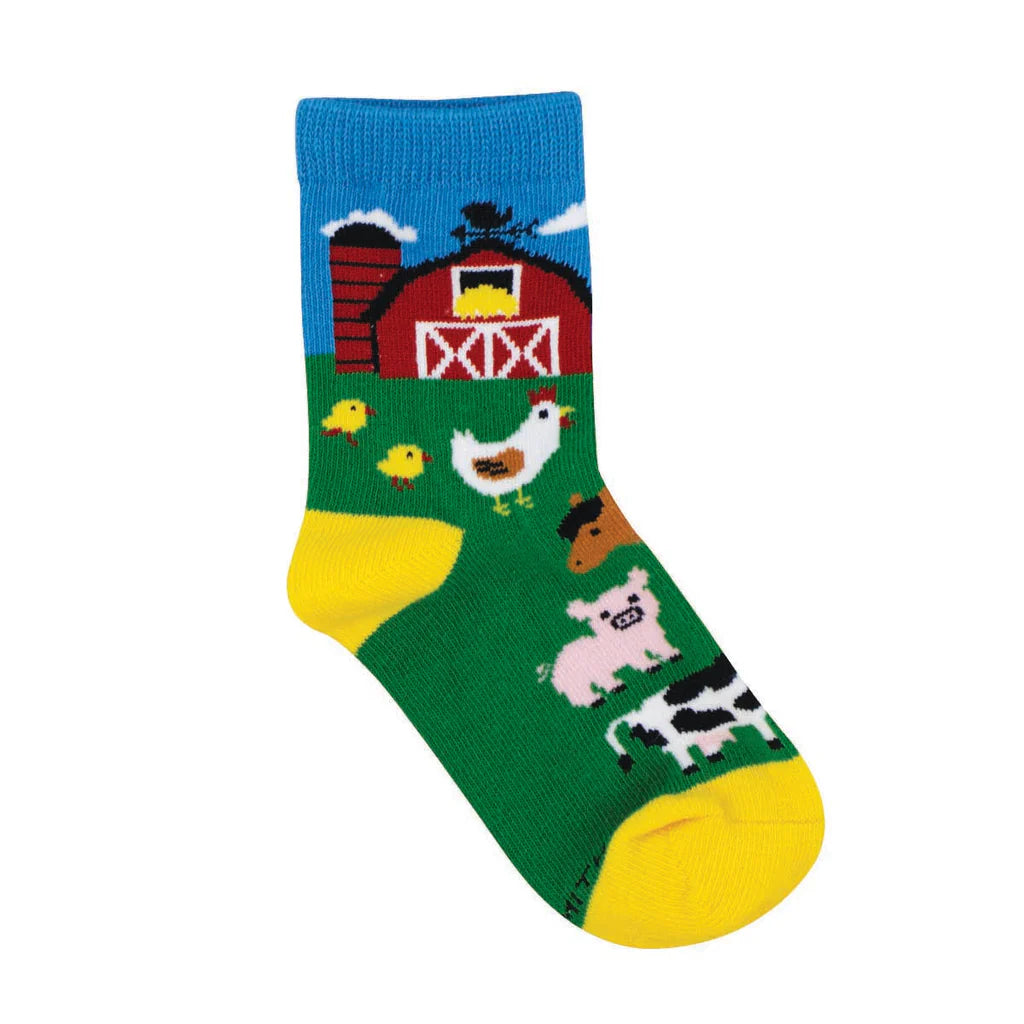 Kids' barnyard farm crew socks in green with red barn and animals, flat single sock shot