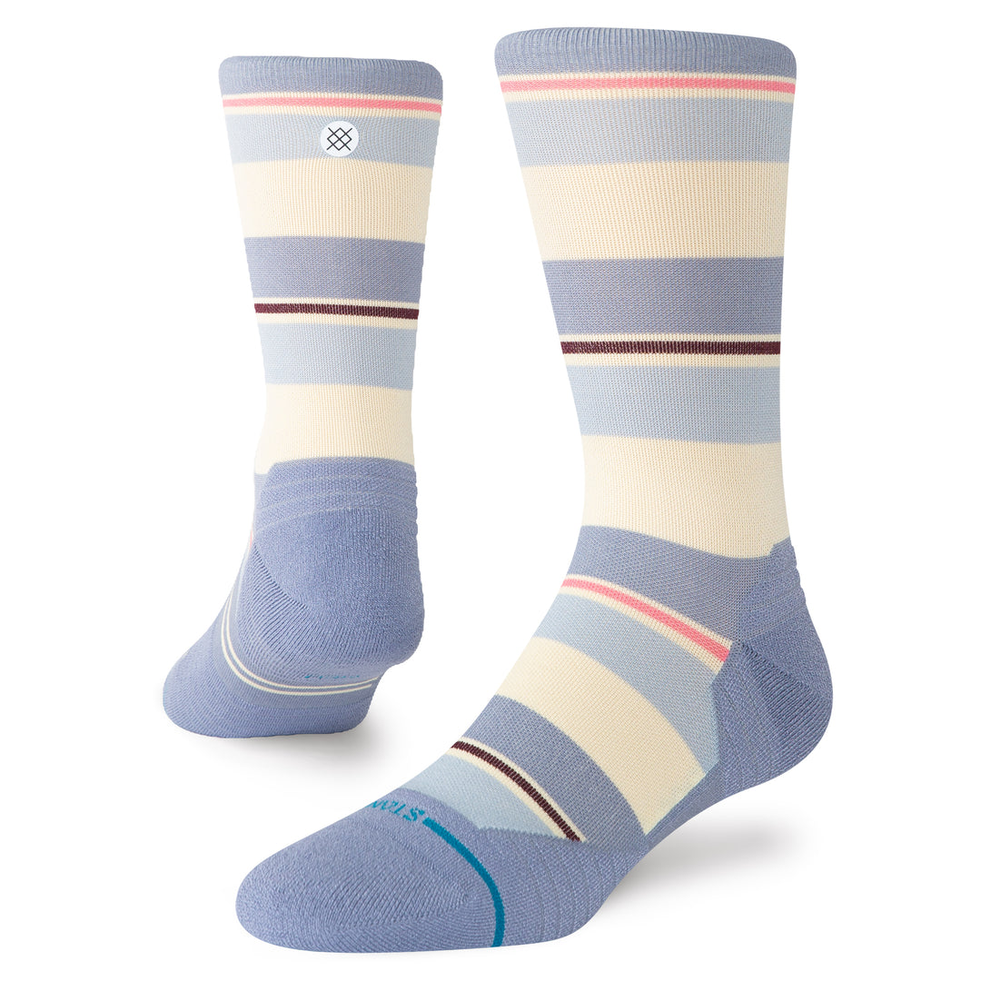 Women's pastel-striped performance crew socks in periwinkle and cream, flat angled view