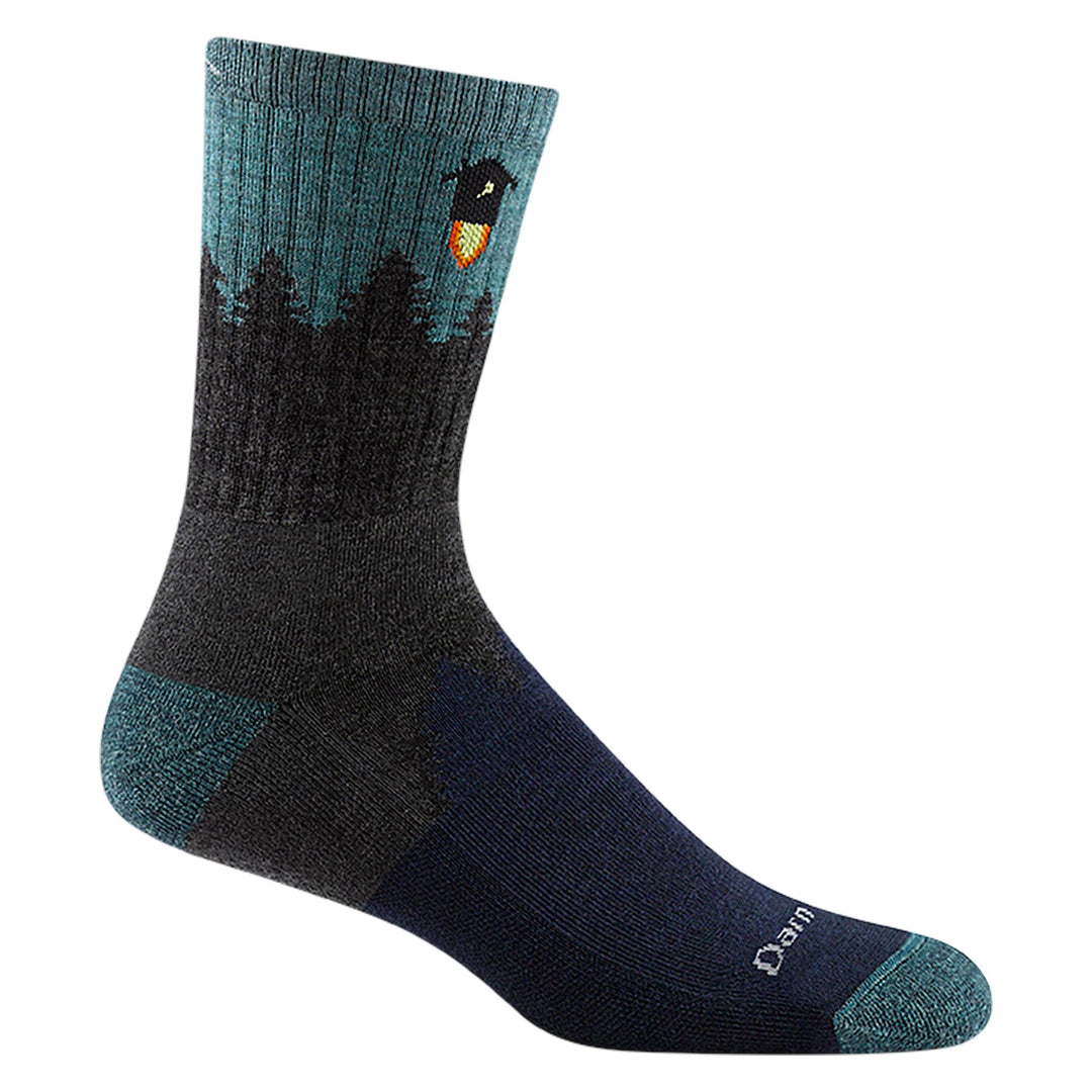 Men's teal and navy micro crew sock with pine forest and songbird, flat side view