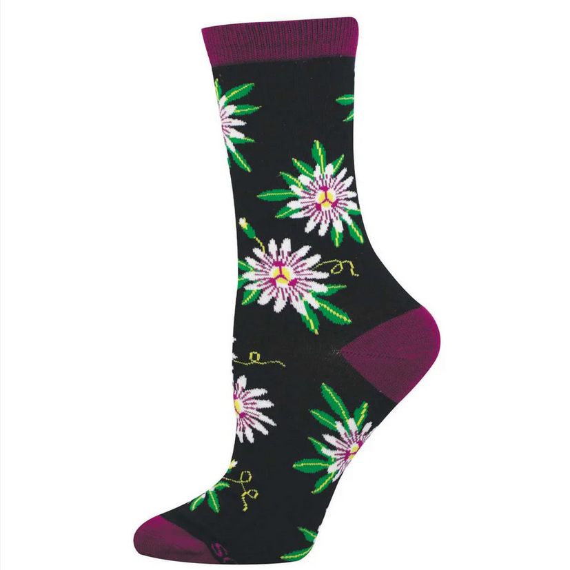 Women's passionfruit flower crew socks laid flat, black with detailed purple-and-white passionflowers and green leaves