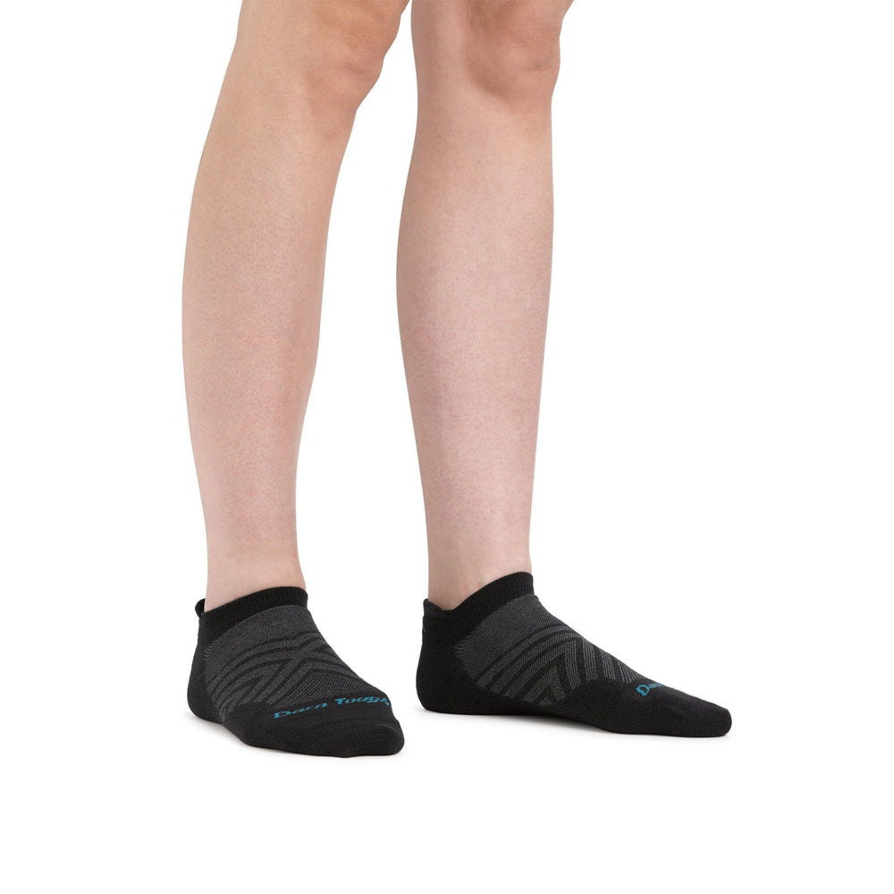 Women's ultra-lightweight no-show tab running socks, worn on legs, black low-cut pair