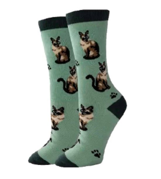 Women's Siamese cat crew socks in sage green, flat lay showing seal-point cats and paw prints