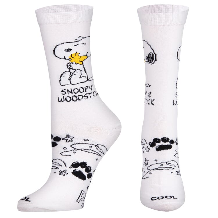 Women's Snoopy and Woodstock crew socks, angled view showing paw-print foot doodles