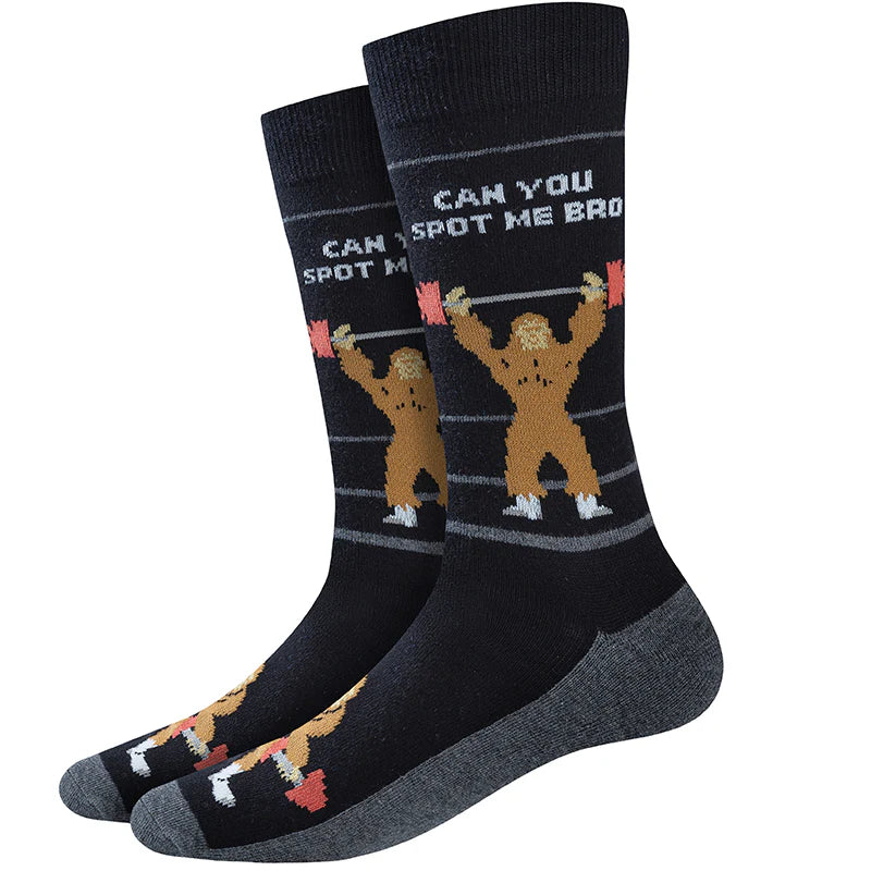 Men's Bigfoot crew socks with a weightlifting Sasquatch, flat lay