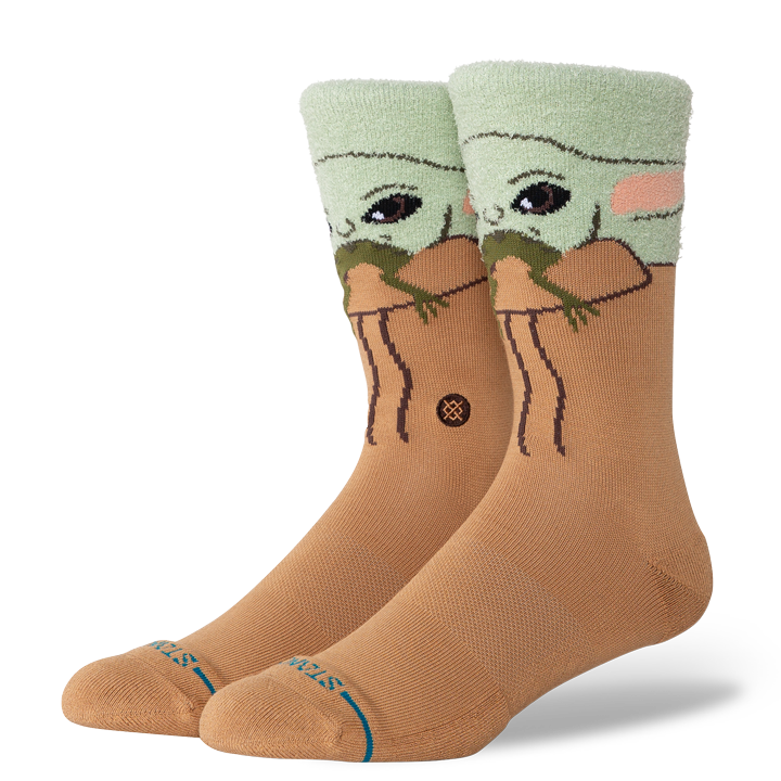 Men's Star Wars Grogu green and tan crew socks, angled view of Baby Yoda face peeking over cuff