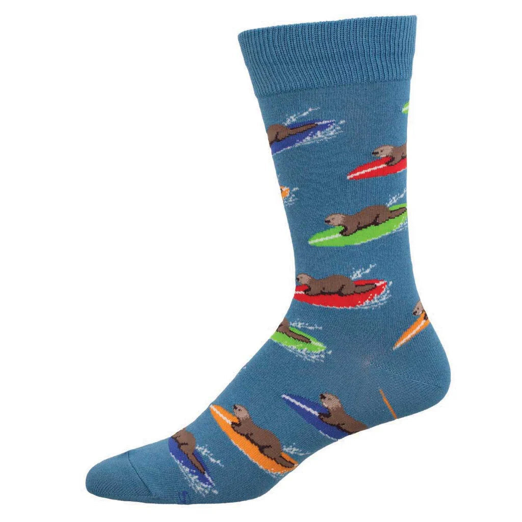 Men's surfing otter crew sock, blue with otters riding colorful surfboards on waves, flat side view