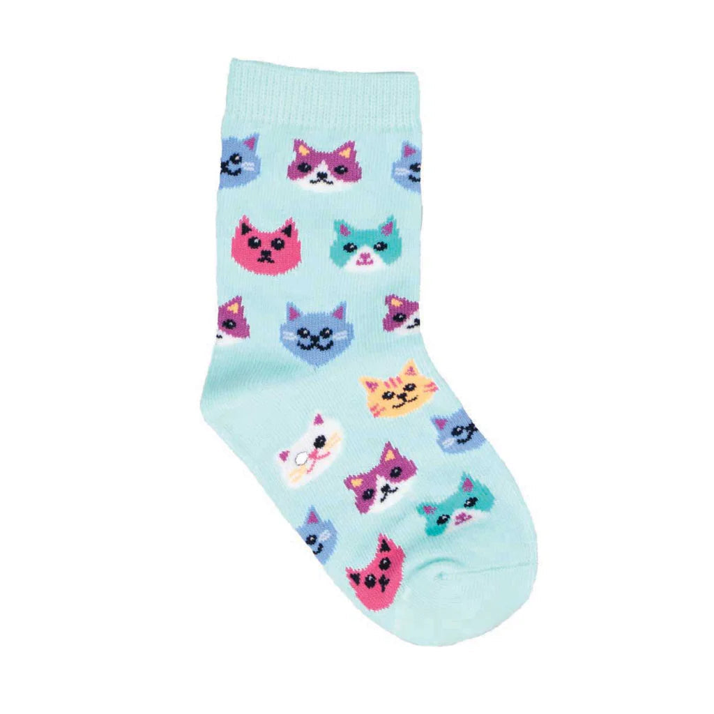Kids' aqua crew sock covered in colorful grinning cat faces, flat product shot