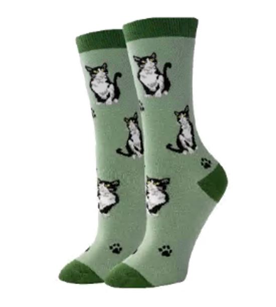 Women's tuxedo cat crew socks in mint green, flat lay showing black-and-white cats and paw prints