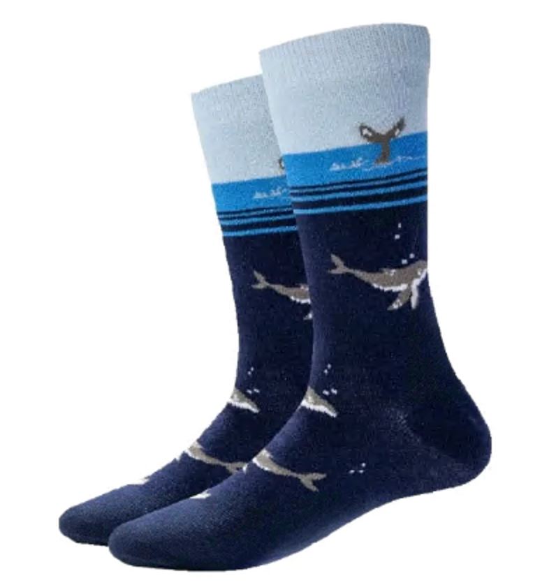 Men's whale crew socks in navy, flat lay showing gray whales and blue ocean-stripe cuff