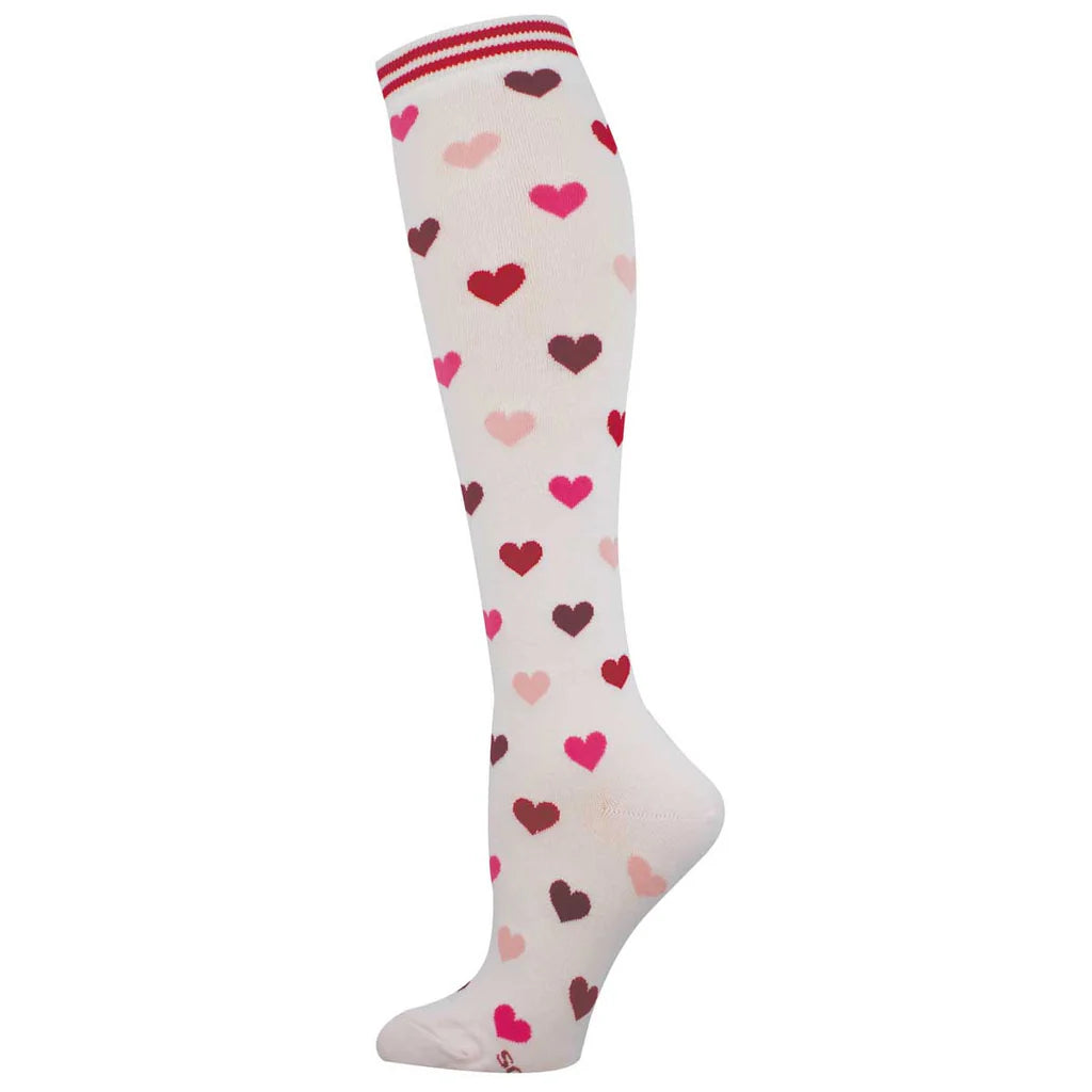 Women's heart-print knee high socks in cream with red and pink hearts and striped cuff, flat single sock shot