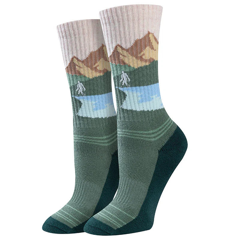 Women's mountain crew socks with green peaks, flat lay