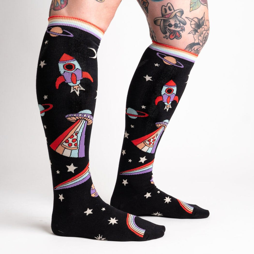 Women's outer space knee high socks worn, second side view on legs