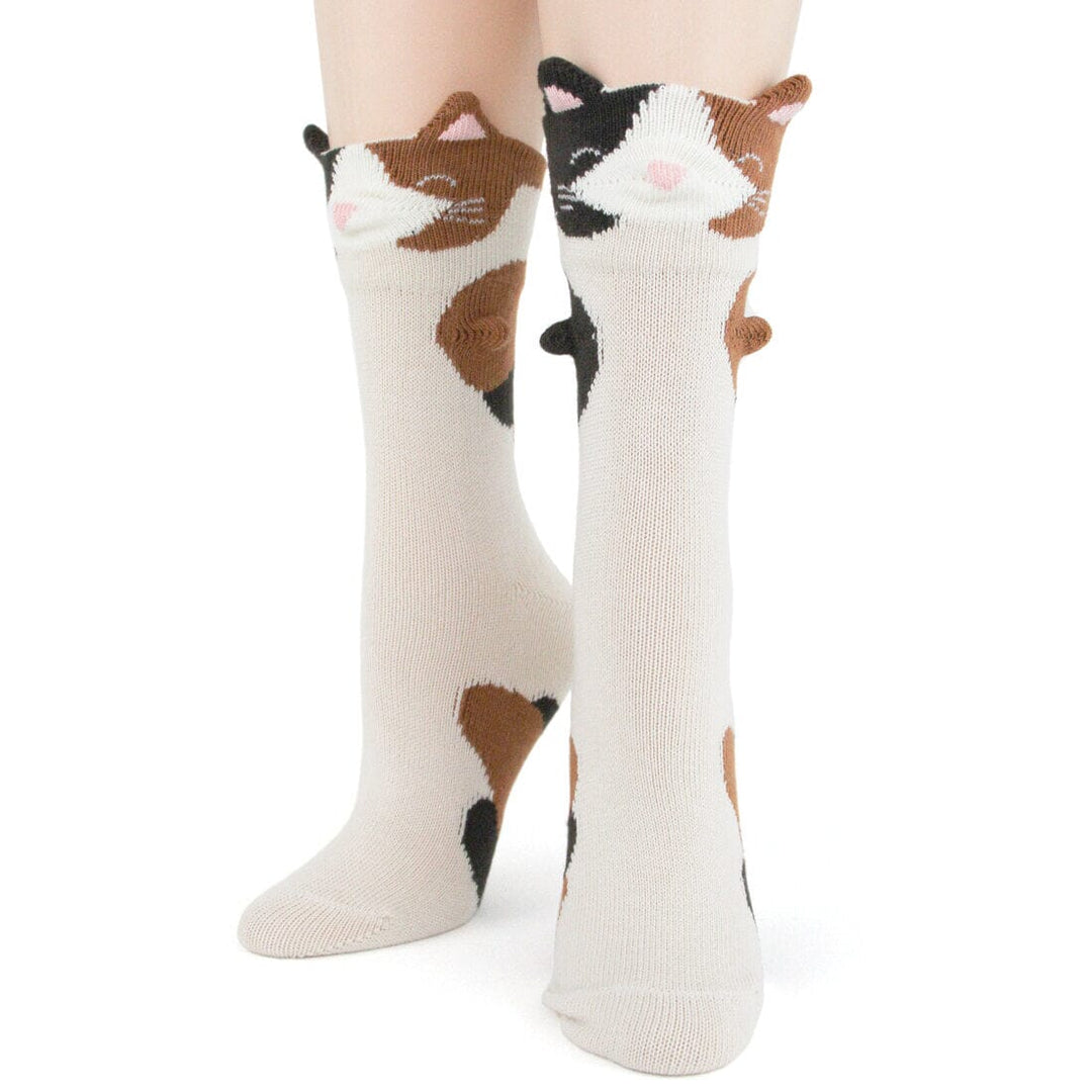 Women's 3D calico cat crew socks in cream with brown and black patches, pop-out cat faces, knit ears and pink noses