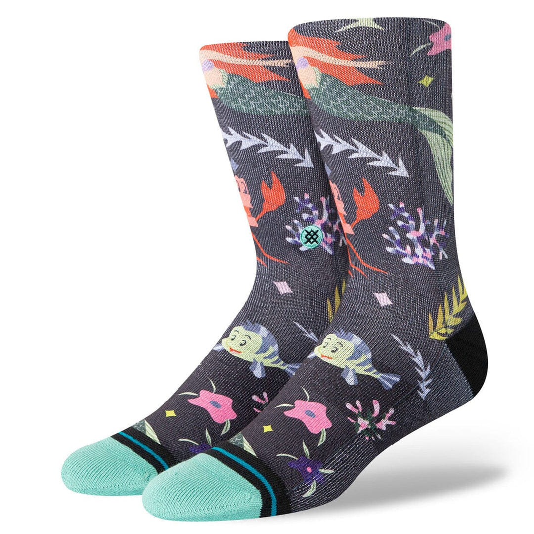 Women's Little Mermaid crew socks laid flat showing Ariel, Sebastian and Flounder on a navy print with mint toes