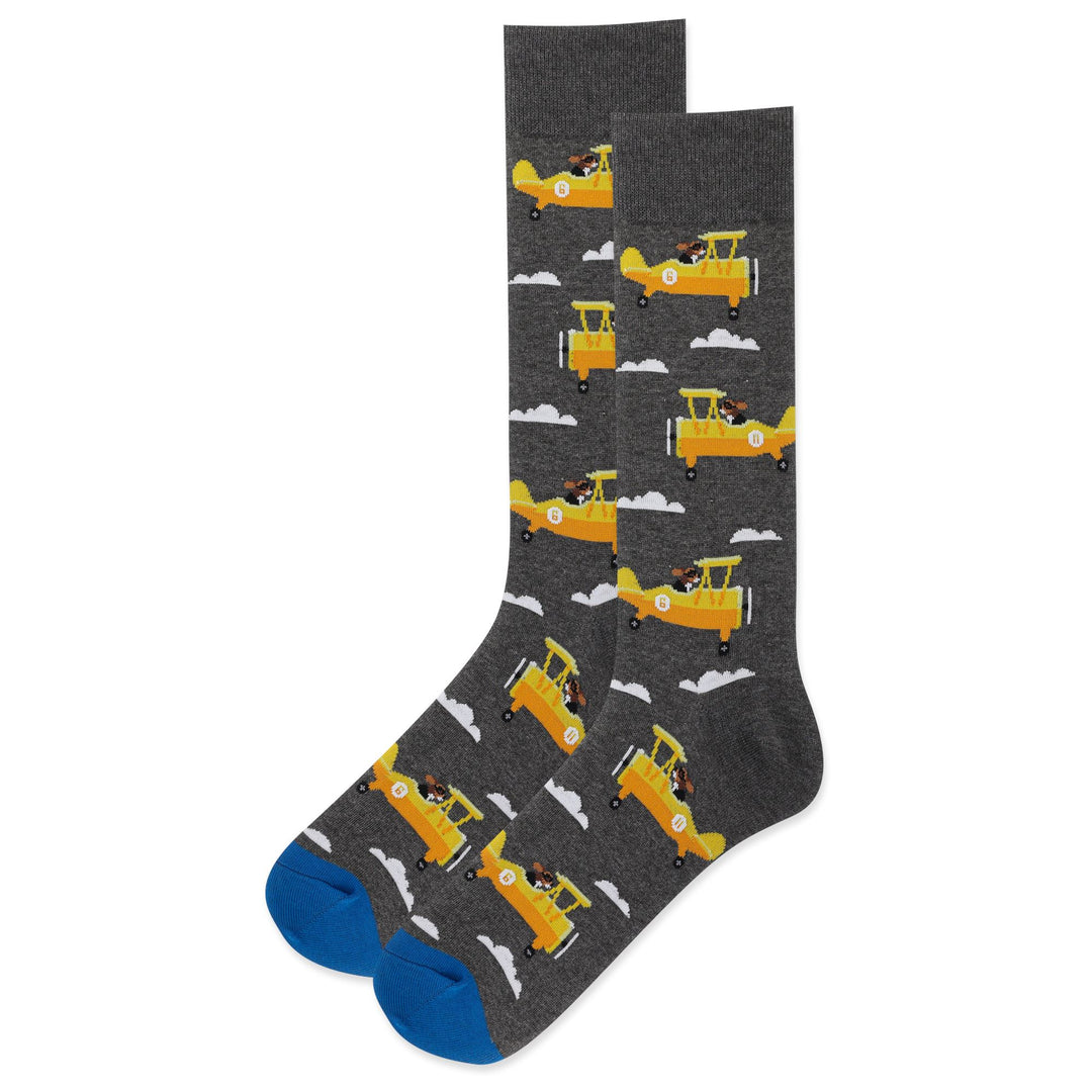 Men's charcoal grey crew socks patterned with yellow biplanes piloted by goggled dogs and white clouds, blue toe