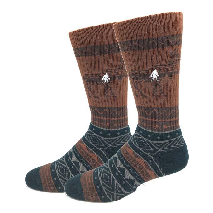 Men's Moose active crew socks in rust and charcoal with tribal-pattern foot and embroidered Sasquatch on the shin