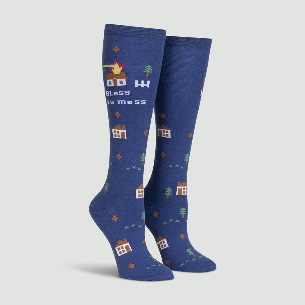 Dusty blue women's knee high socks with a dragon torching a house and a Bless This Mess message, plus tiny houses and trees, on foot forms