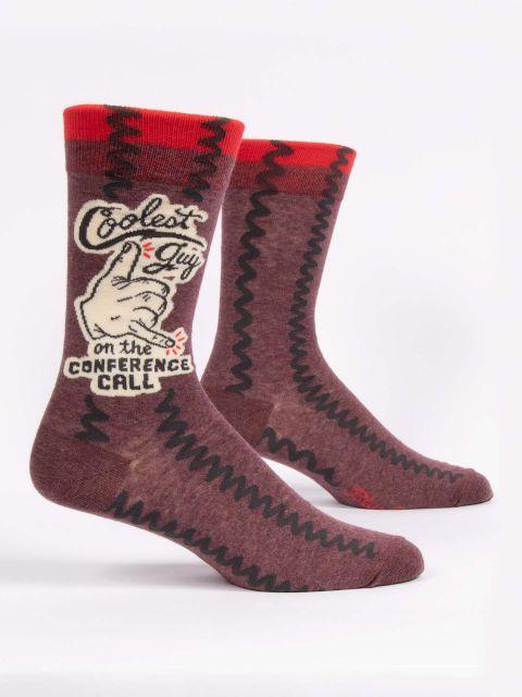 Men's maroon zigzag crew socks shown from the side with a retro "Coolest Guy on the Conference Call" badge