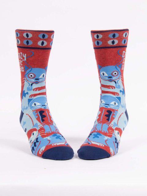 Men's crazy cat dude crew socks shown from the front with eyeball cuffs and navy toes