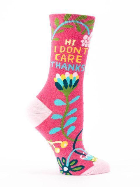 Raspberry-pink women's crew sock reading Hi I Don't Care Thanks among teal and yellow folk-art flowers, with a pink cuff and heel