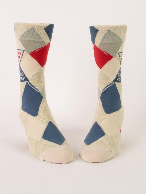 Front view of the men's argyle socks standing upright, showing the diamond pattern and lettered banner