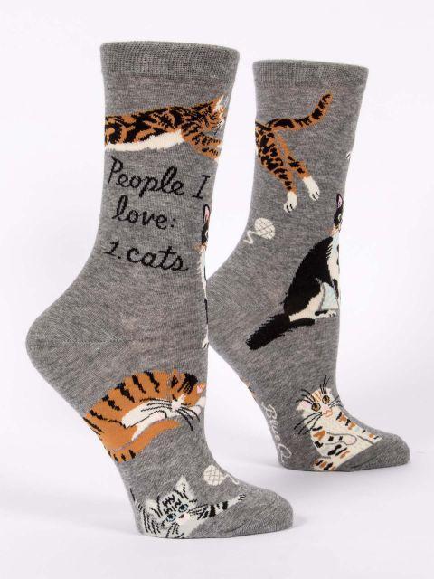 Pair of women's gray crew socks shown from the side with 'People I love: 1. cats' text and several cats
