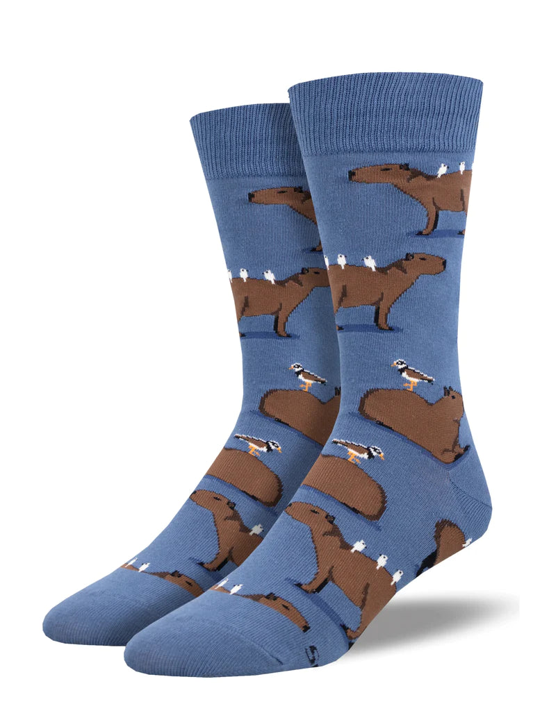 Men's denim-blue crew socks patterned with chunky brown capybaras lounging on small hills