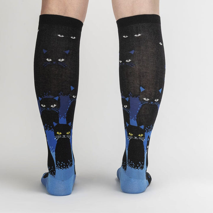 Back view of the black cat knee high socks on a model&