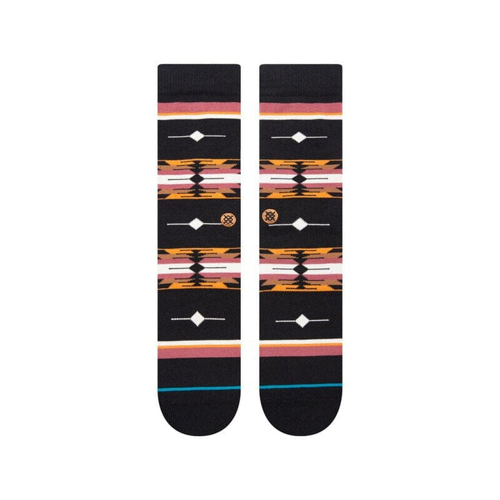 Top-down view of the black socks showing the symmetrical Southwestern diamond-and-stripe pattern