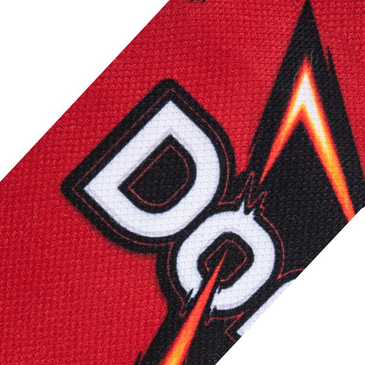 Close-up knit detail of the white Doritos logo lettering on the red background