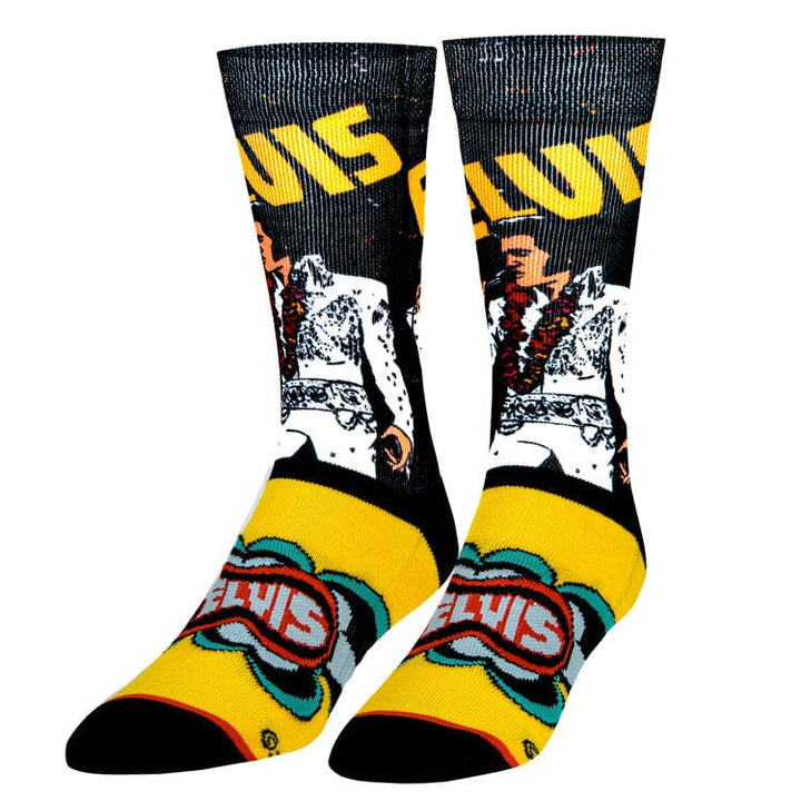 Elvis crew socks toe-down, Elvis in white jumpsuit singing into a mic with yellow ELVIS text and logo on the foot