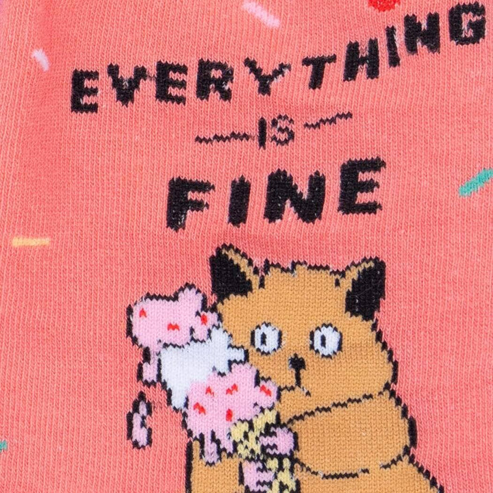 Close-up of the cat clutching a melting ice cream cone under the &