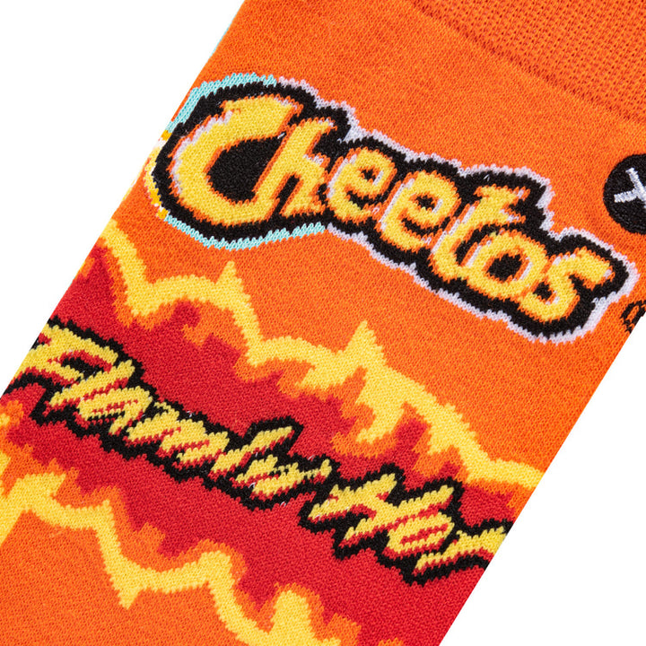 Close-up of the knit Cheetos logo and Flamin&