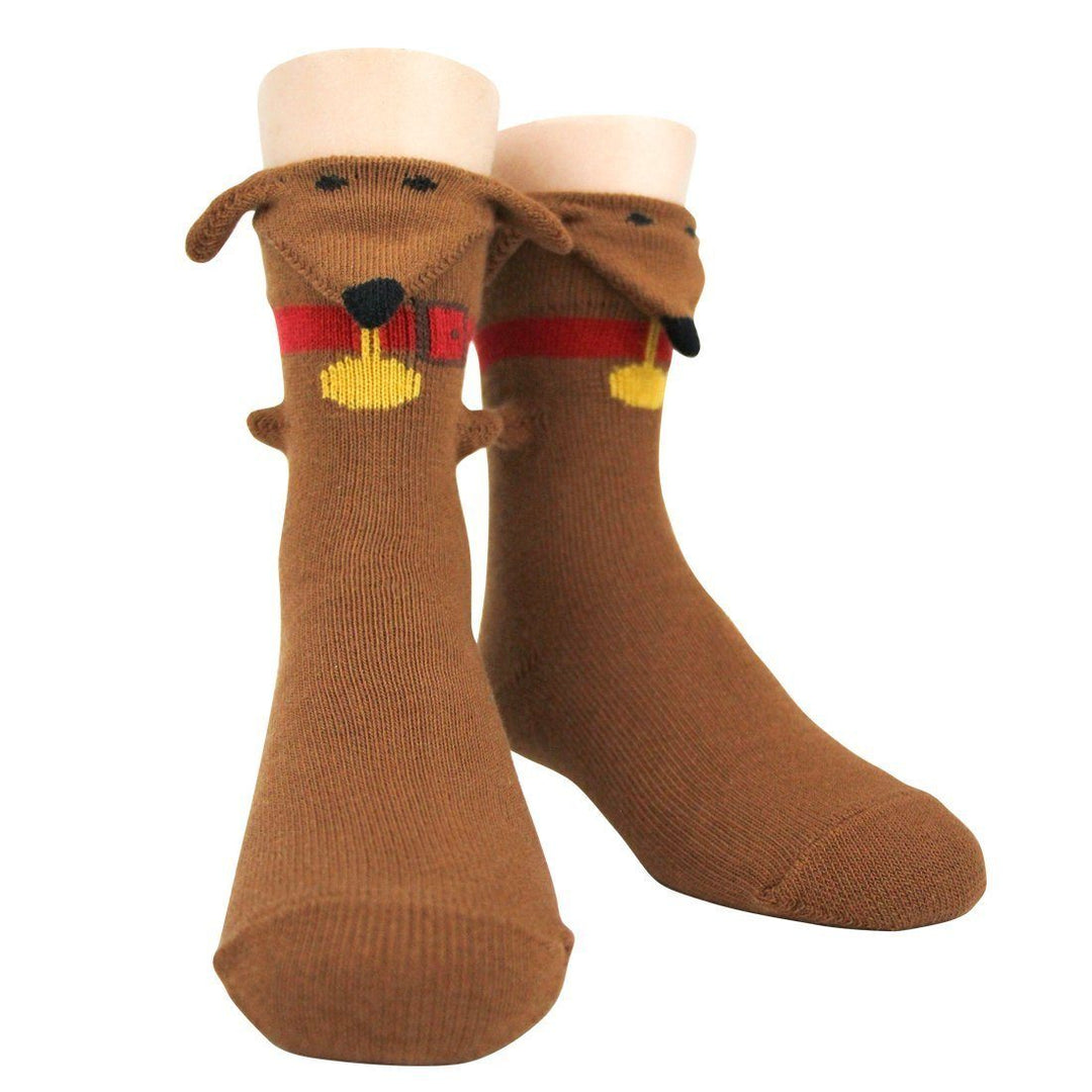 Kids' brown crew socks on foot forms featuring a 3D dachshund face with floppy ears, red collar, and tag at the cuff