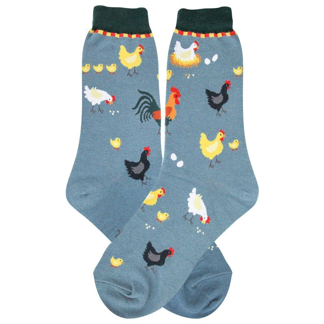 Women's slate-blue crew socks covered in roosters, hens, baby chicks, and eggs