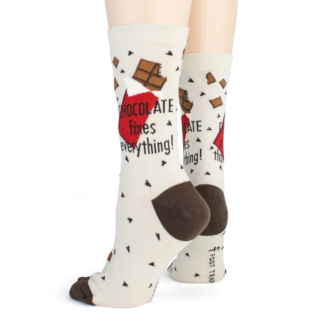 Side and rear angle of the worn chocolate socks highlighting the mocha heel and chocolate-bar print