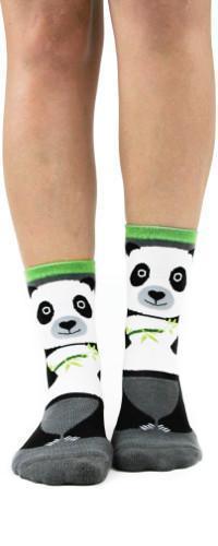 Feet in white slipper socks with a panda face holding green bamboo, lime green cuff and gray sole