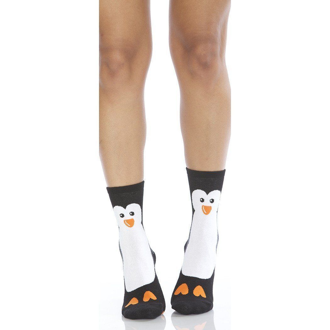Pair of black and white penguin slipper socks with orange beaks, eyes on the cuff, and orange feet at the toes